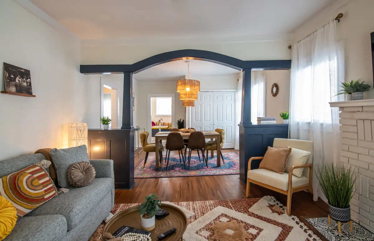 Unit A living room with an arched opening
